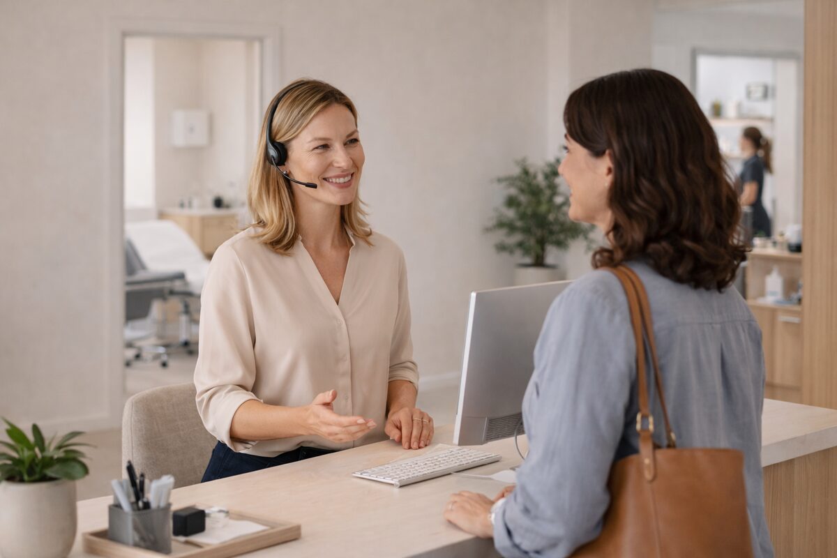Reception staff welcoming a client in a calm professional service space